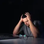 1365813 young man works computer night169016 59488